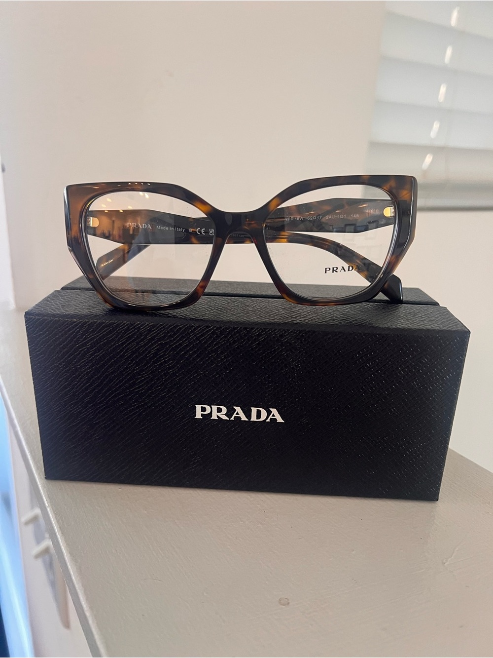 Prada Tortoiseshell Cat-Eye Glasses in Brown